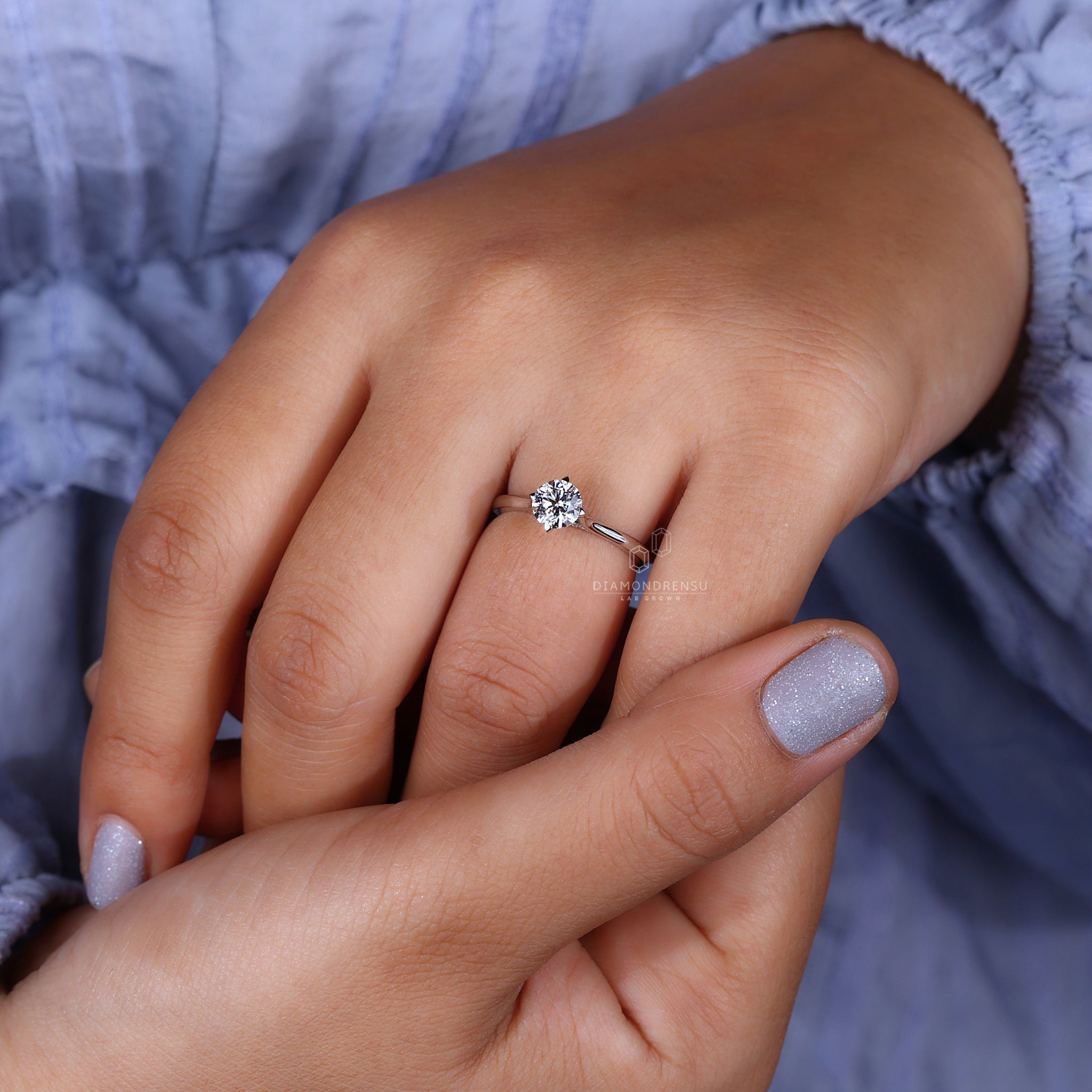 Bridge setting ring with a dazzling white gold finish.