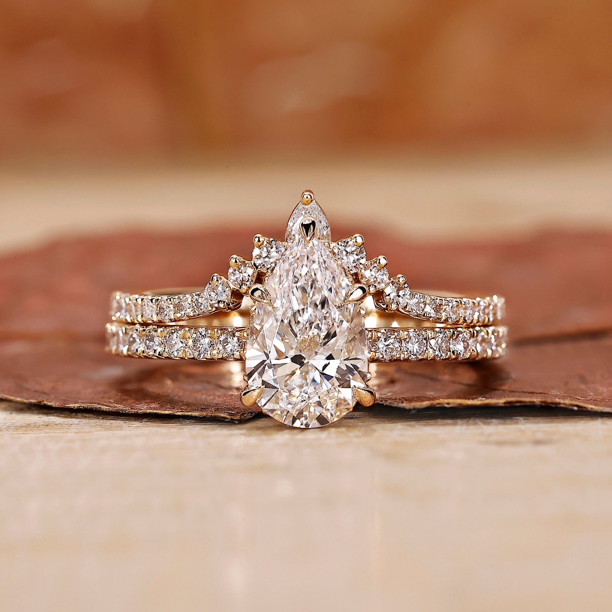 Pear shape engagement ring with band.
