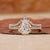 Pear shape engagement ring with band.
