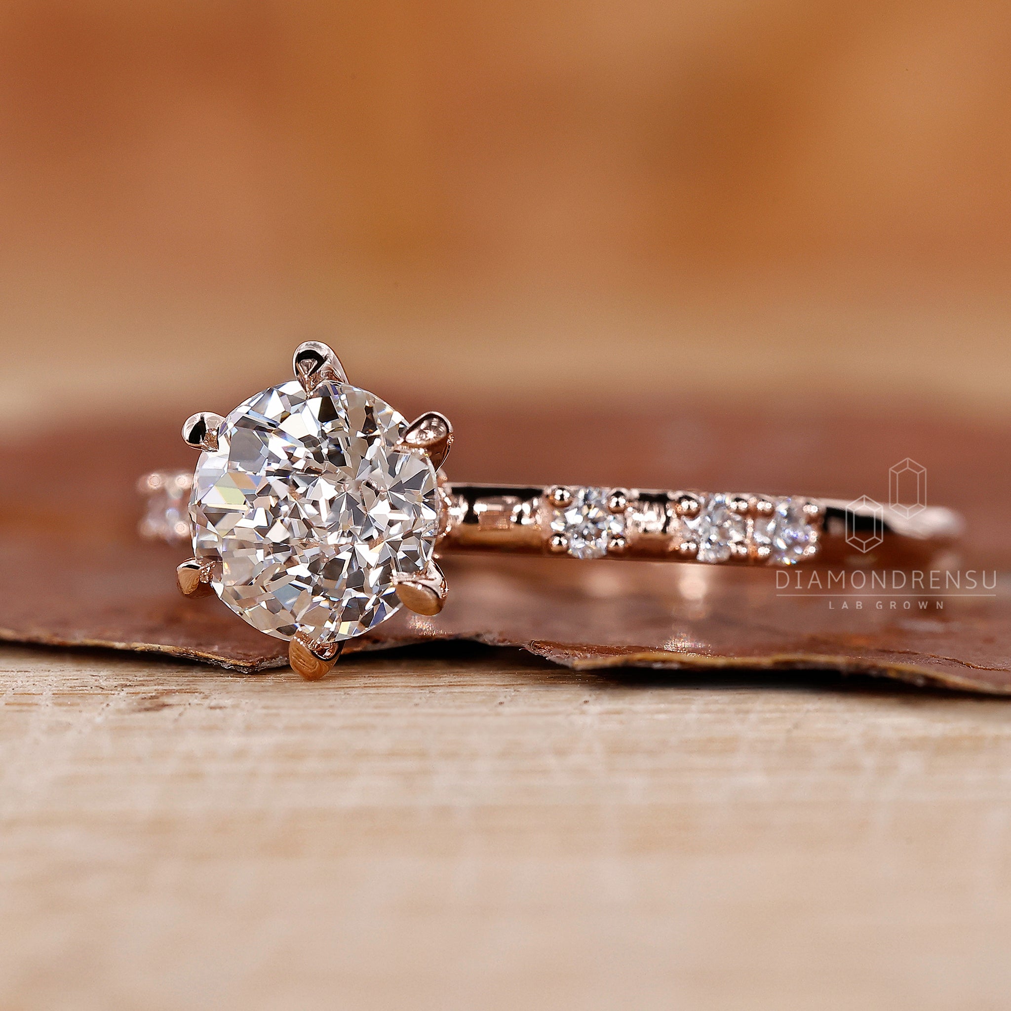 Diamondrensu UK engagement ring with a pave setting and handmade jewellery style.
