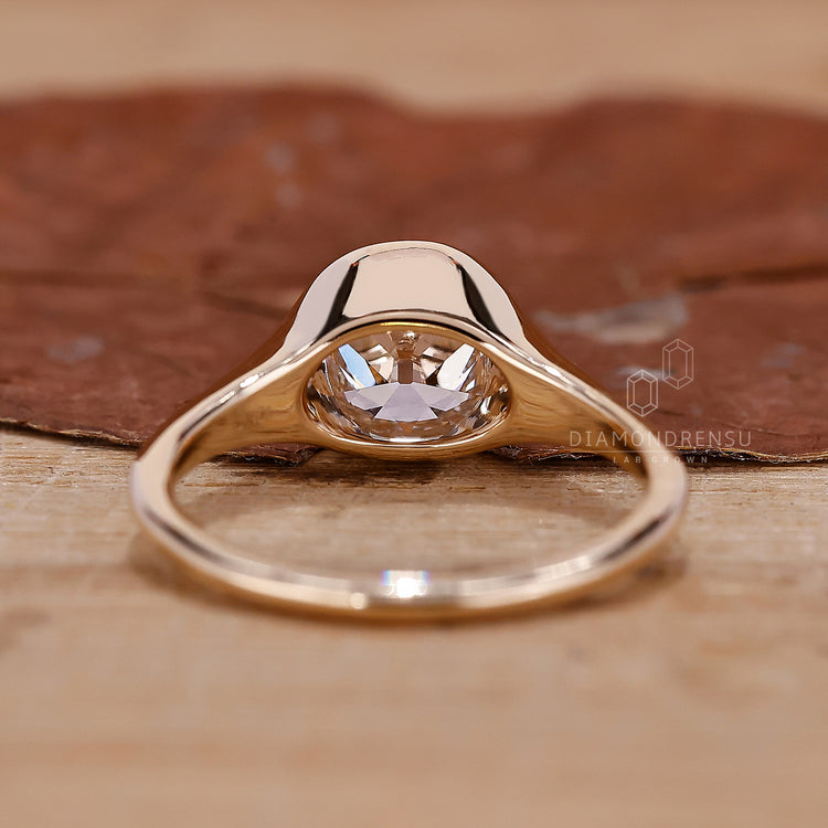 UK engagement ring styled as bezel set engagement ring.
