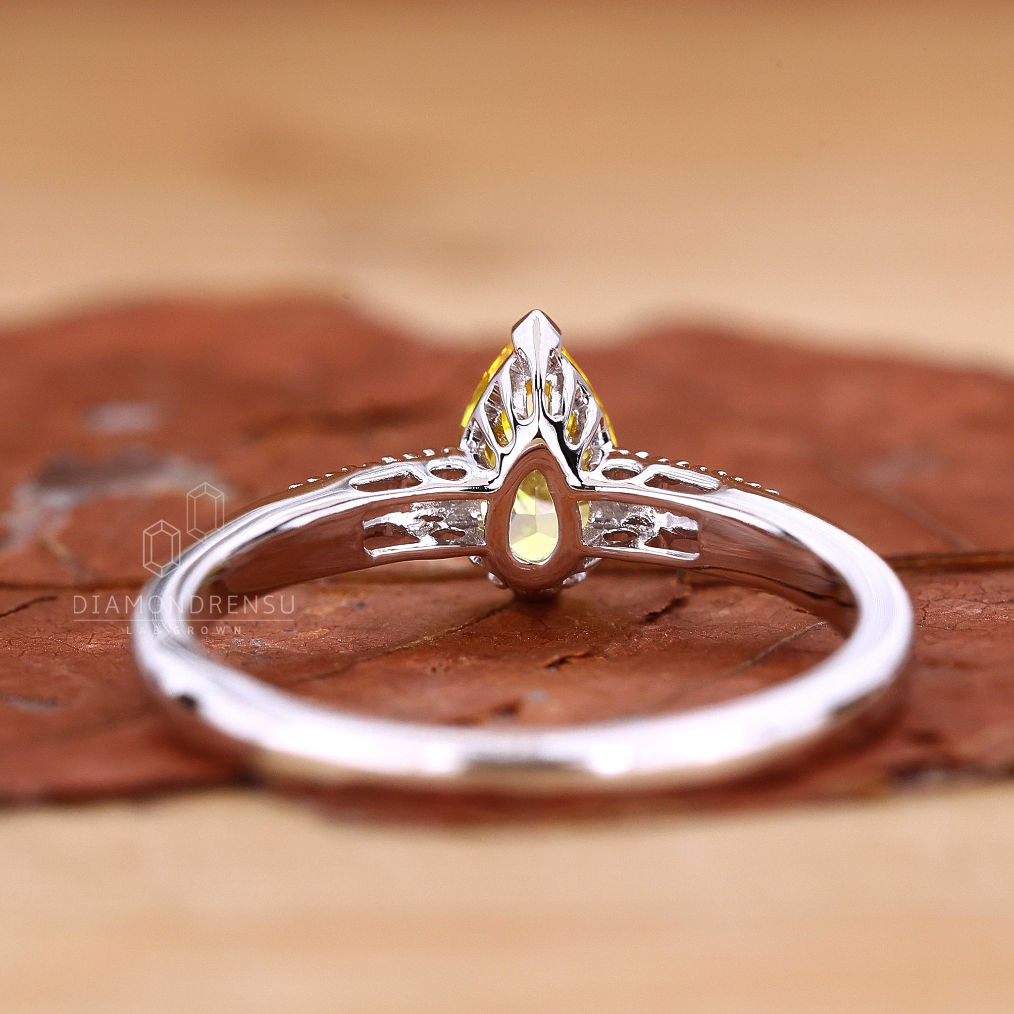 Buy engagement ring with pear diamond engagement ring.
