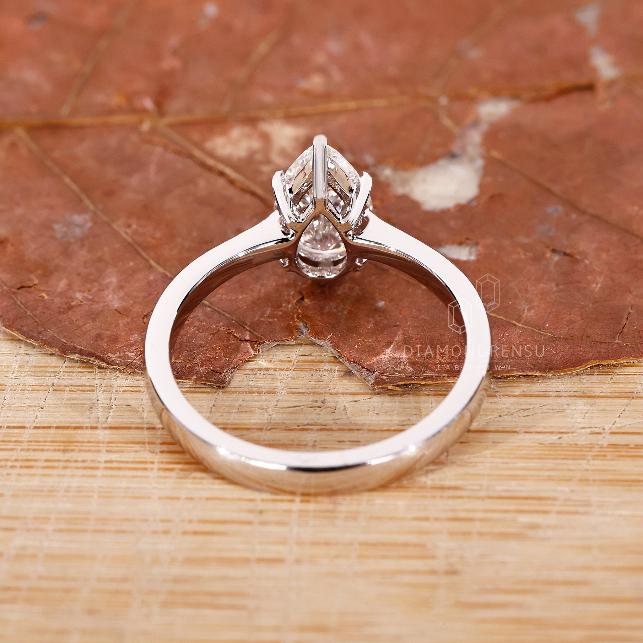 UK engagement ring designed with tapered pave style.
