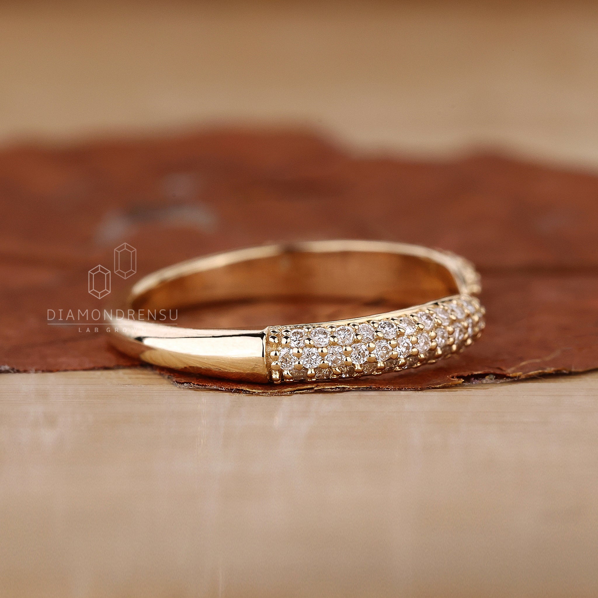 Handmade yellow gold open gap diamond band.
