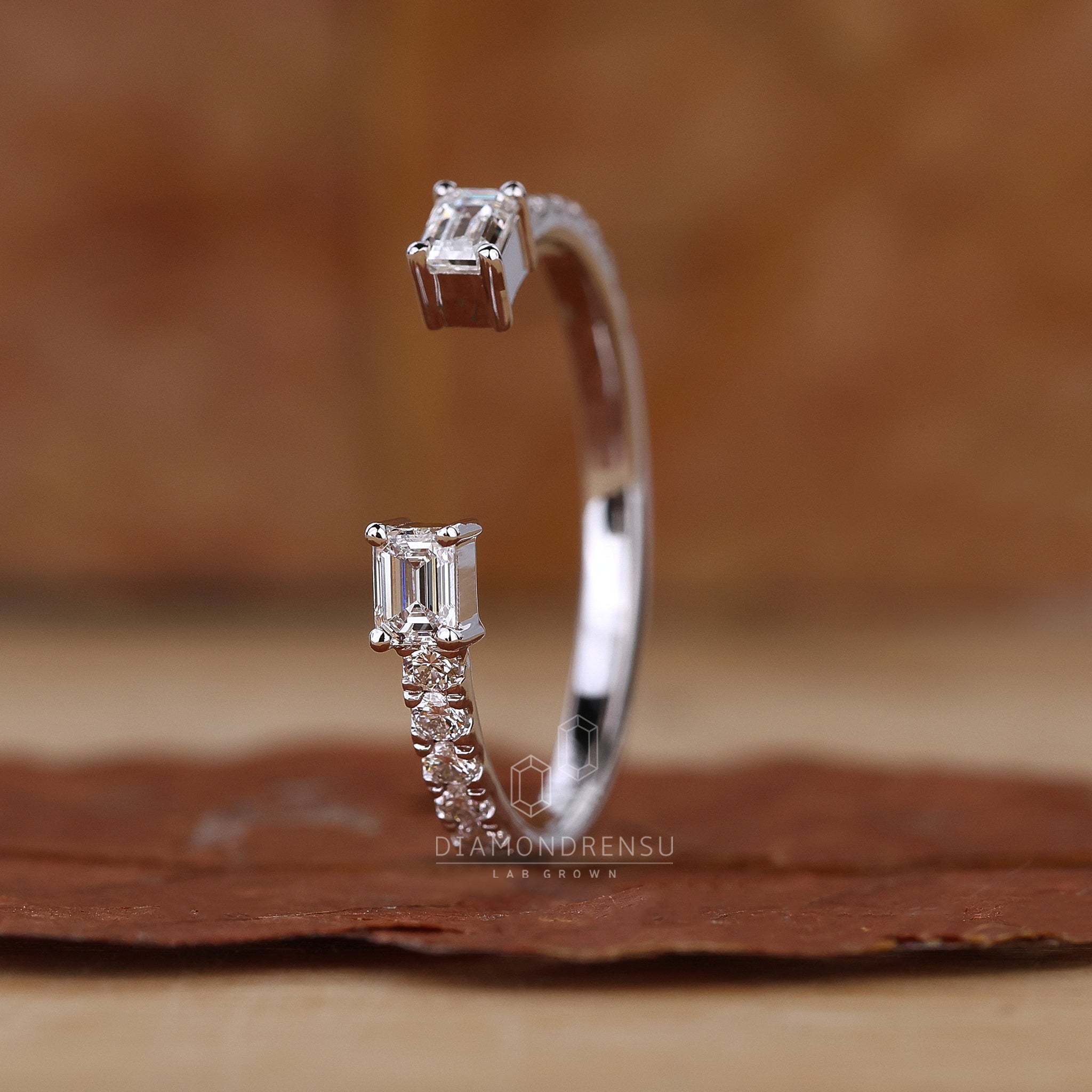 UK wedding band with open design and mixed diamond cuts
