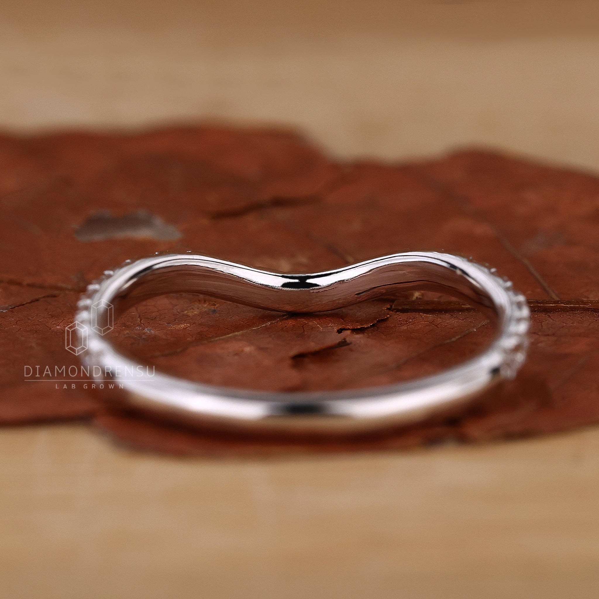 Lab grown diamond half eternity curved band.

