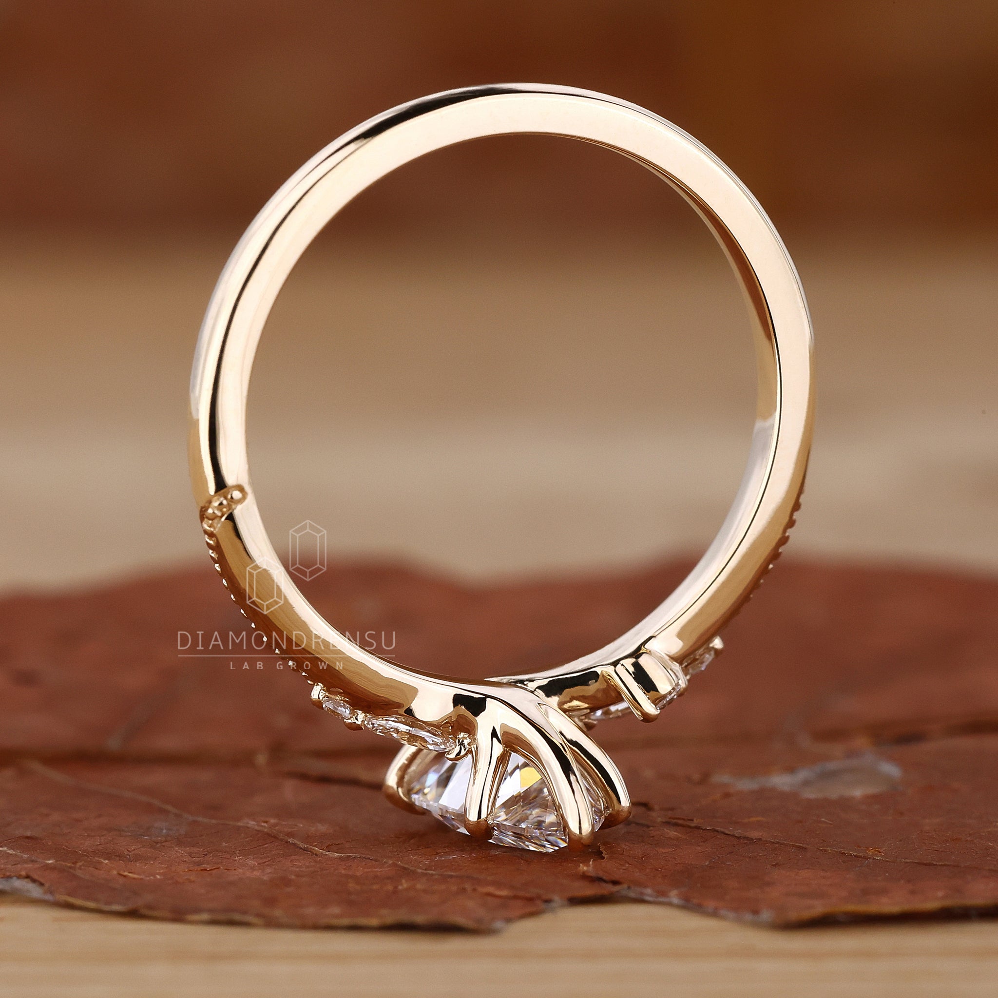 Yellow gold ring with a lab grown diamond centrepiece.