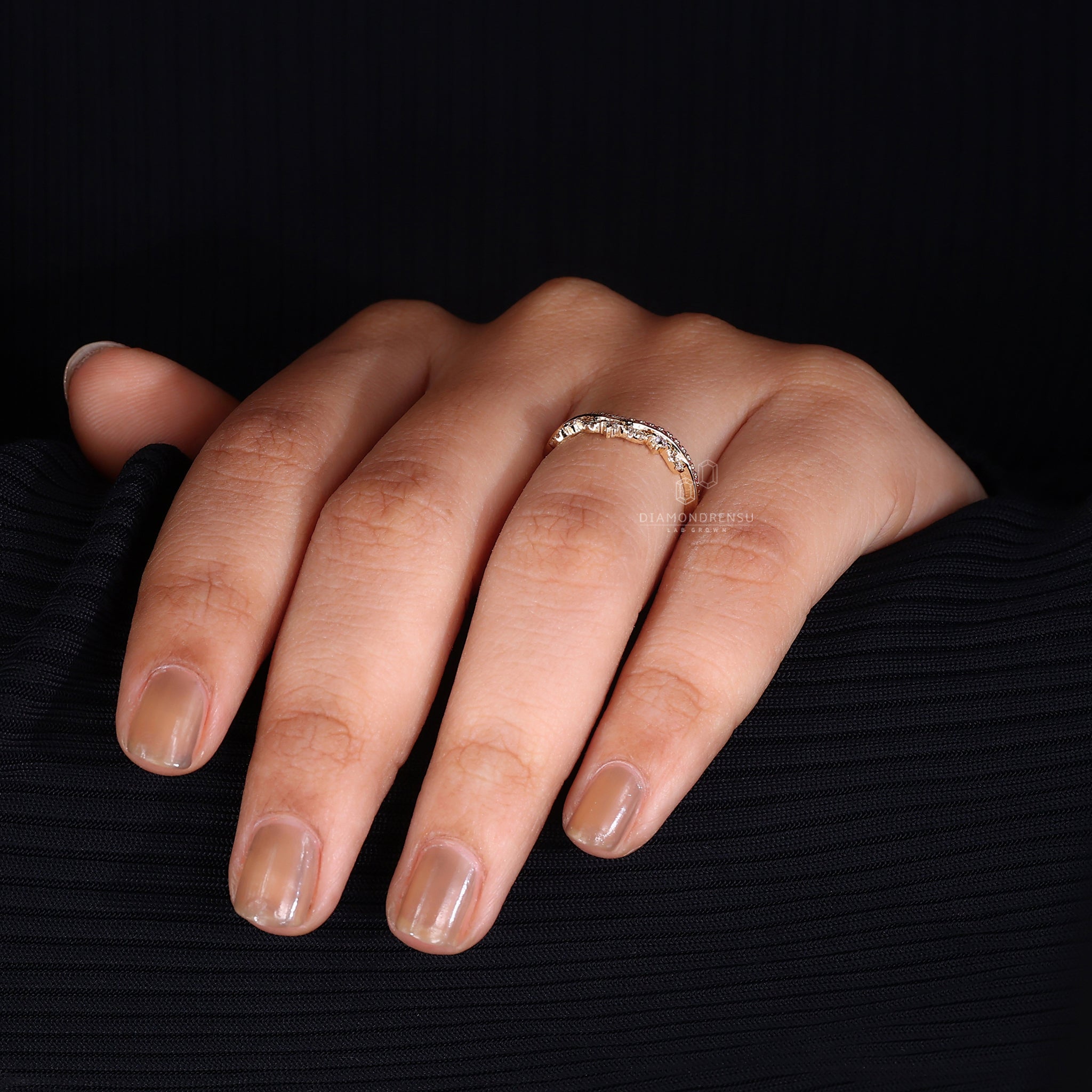 Lab grown pink and white diamond wedding band.
