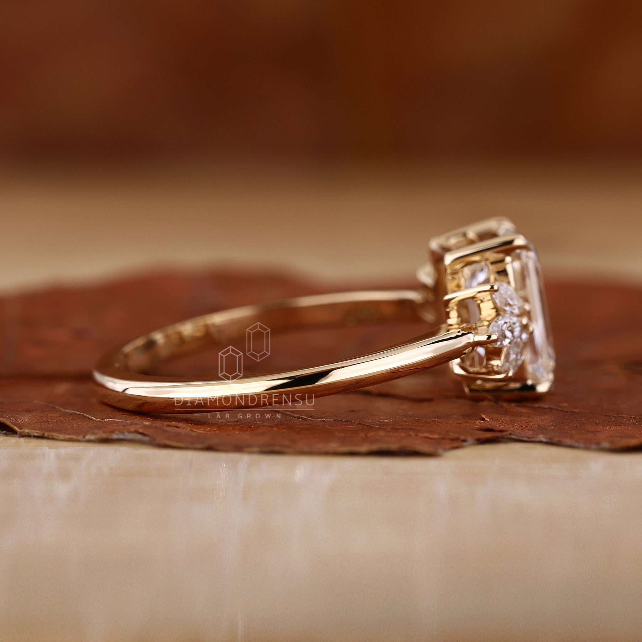 Yellow gold engagement ring with emerald diamond.
