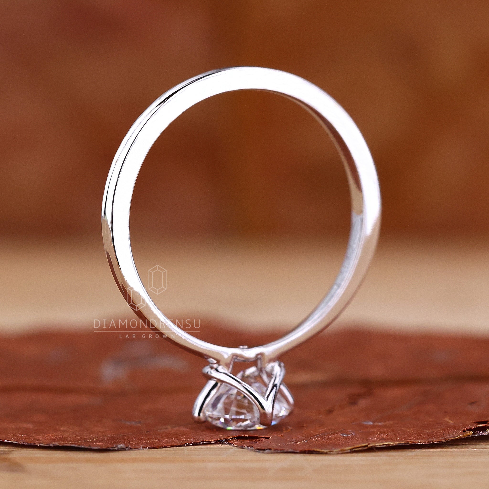 UK engagement ring with compass prong.
