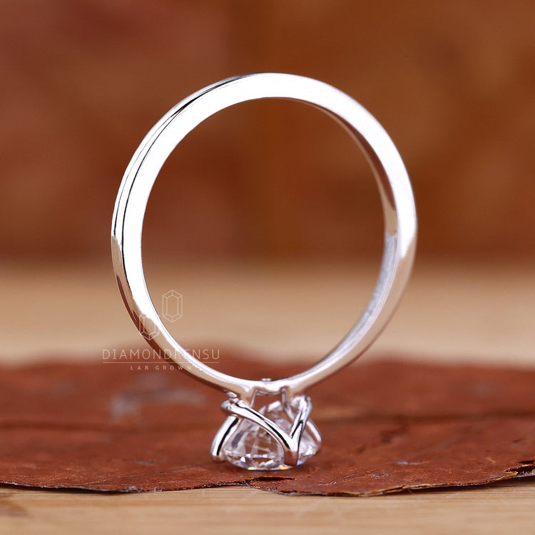 UK engagement ring with compass prong.
