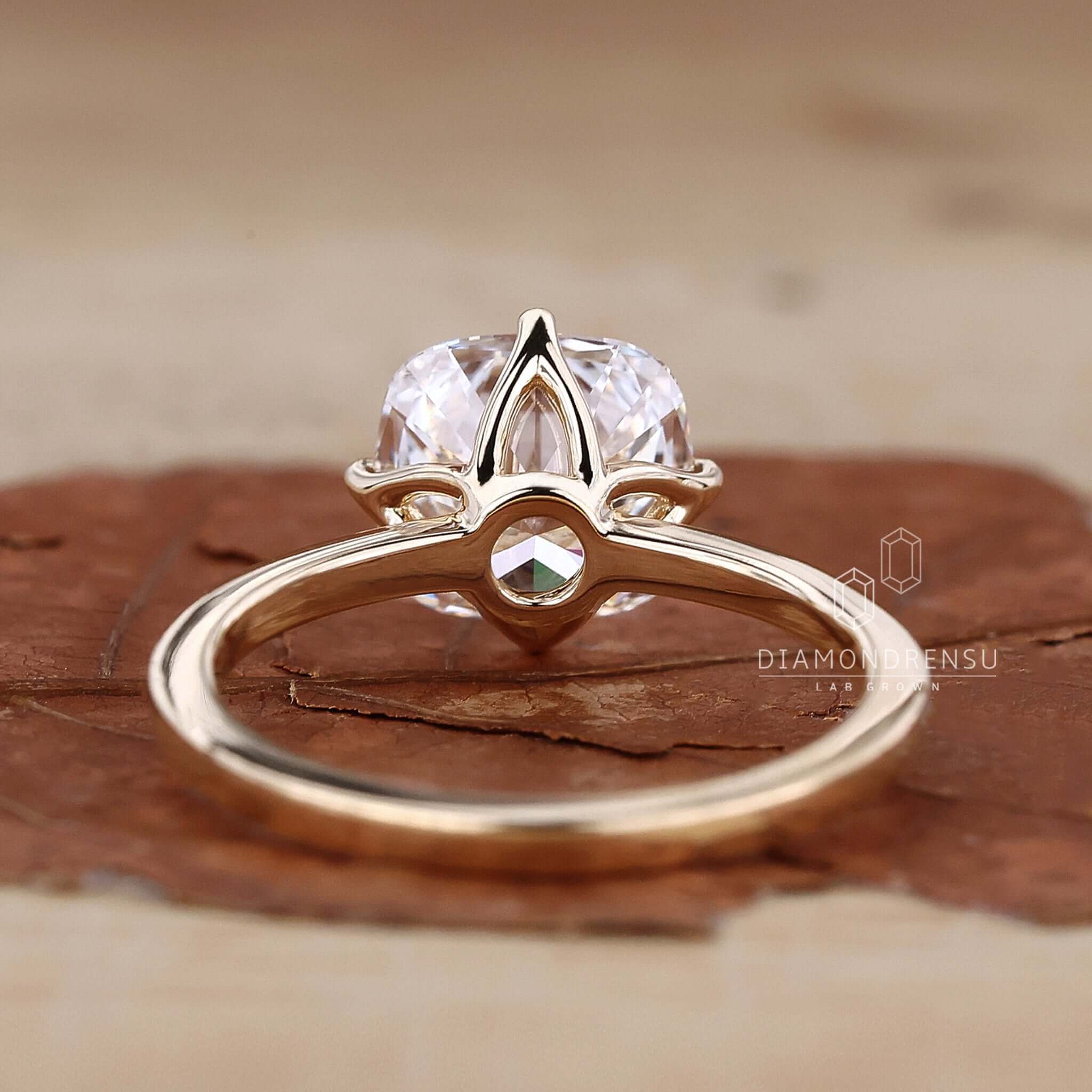 Gold solitaire engagement ring crafted with lab grown diamond for eco-friendly luxury.