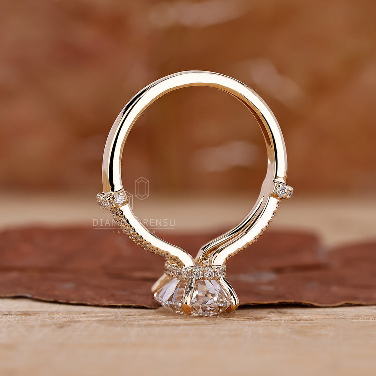 Handmade ring with oval cut diamond ring and hidden halo style.

