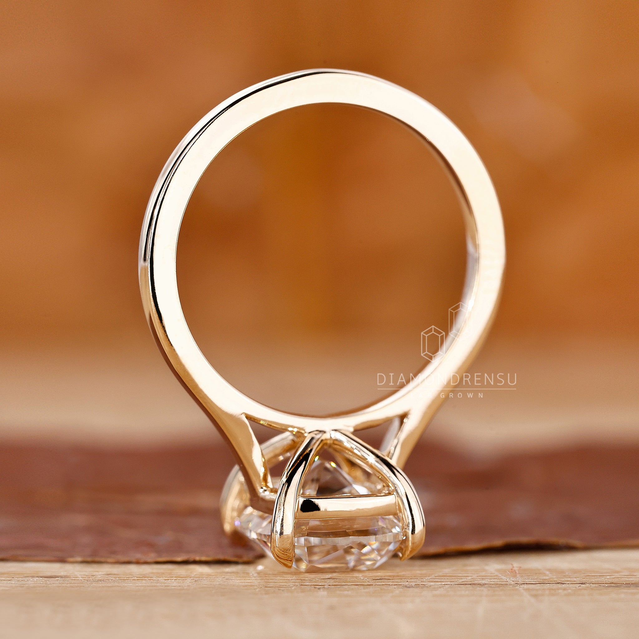 Handmade ring shows old mine cut design in a cathedral setting.
