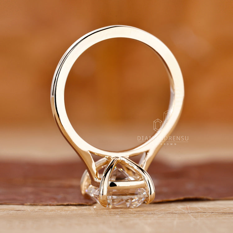 Handmade ring shows old mine cut design in a cathedral setting.
