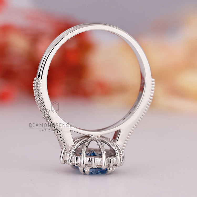 Handmade ring with radiant cut and halo setting is used.
