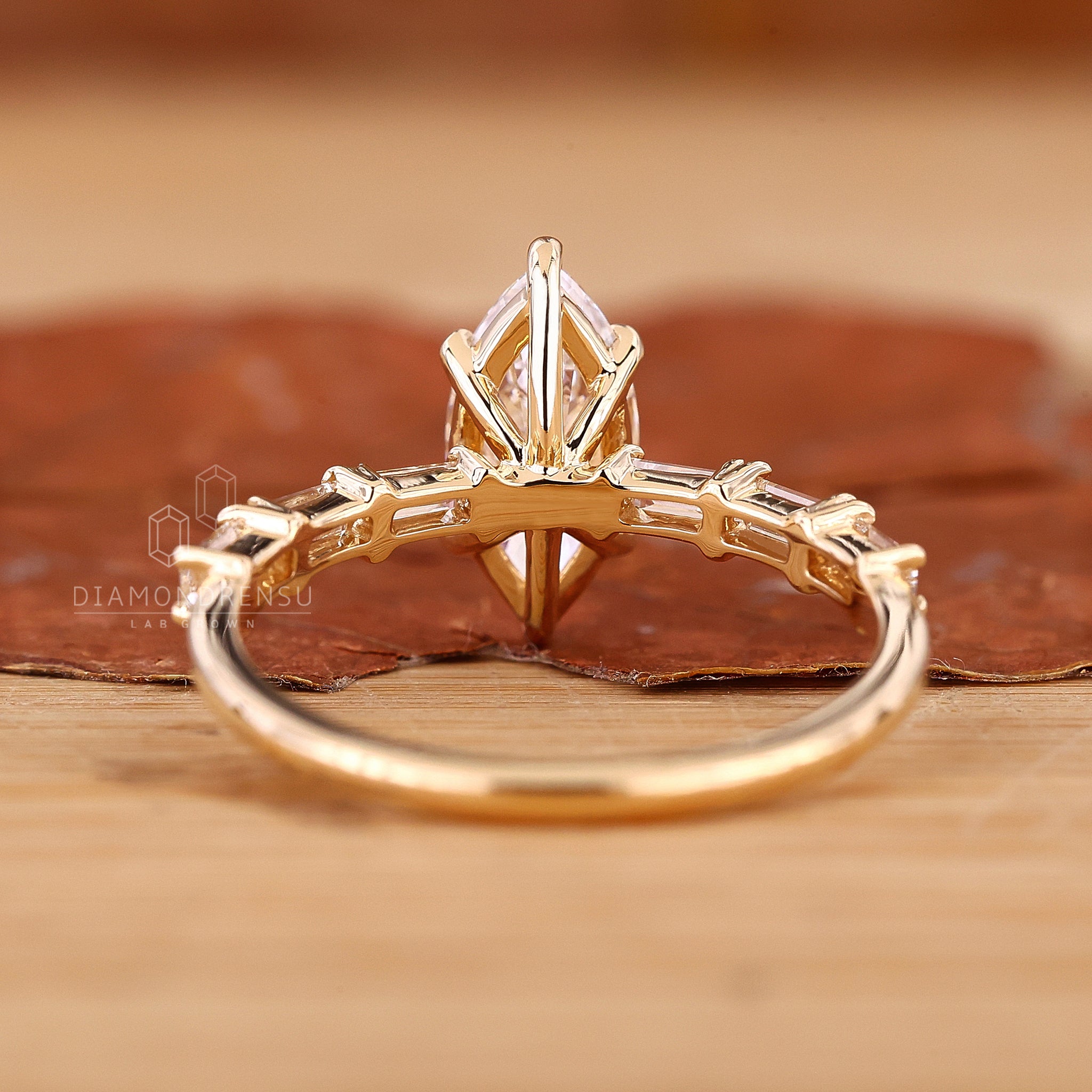 Yellow gold engagement ring with marquise cut.
