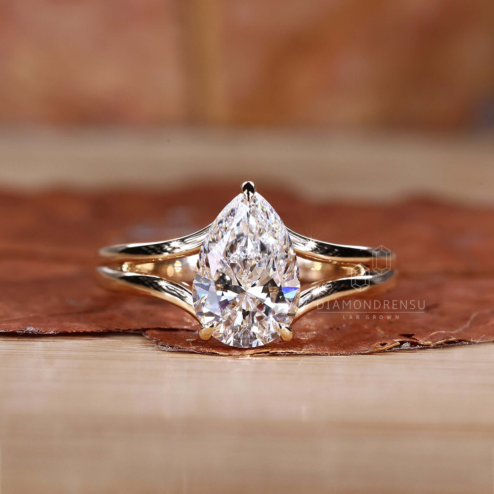 Pear Solitaire Engagement Ring with a stunning pear-shaped centrepiece.