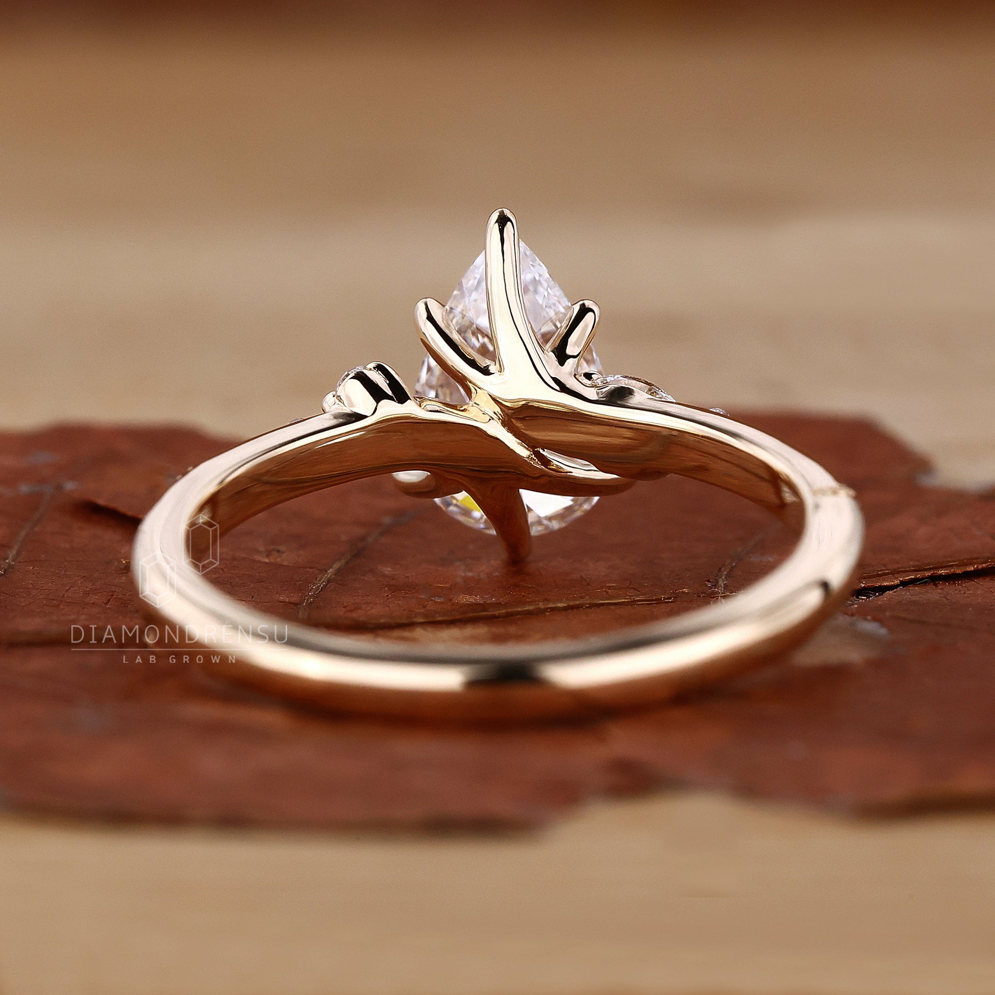 Diamond ring with marquise side stones in 6 prong claw setting.