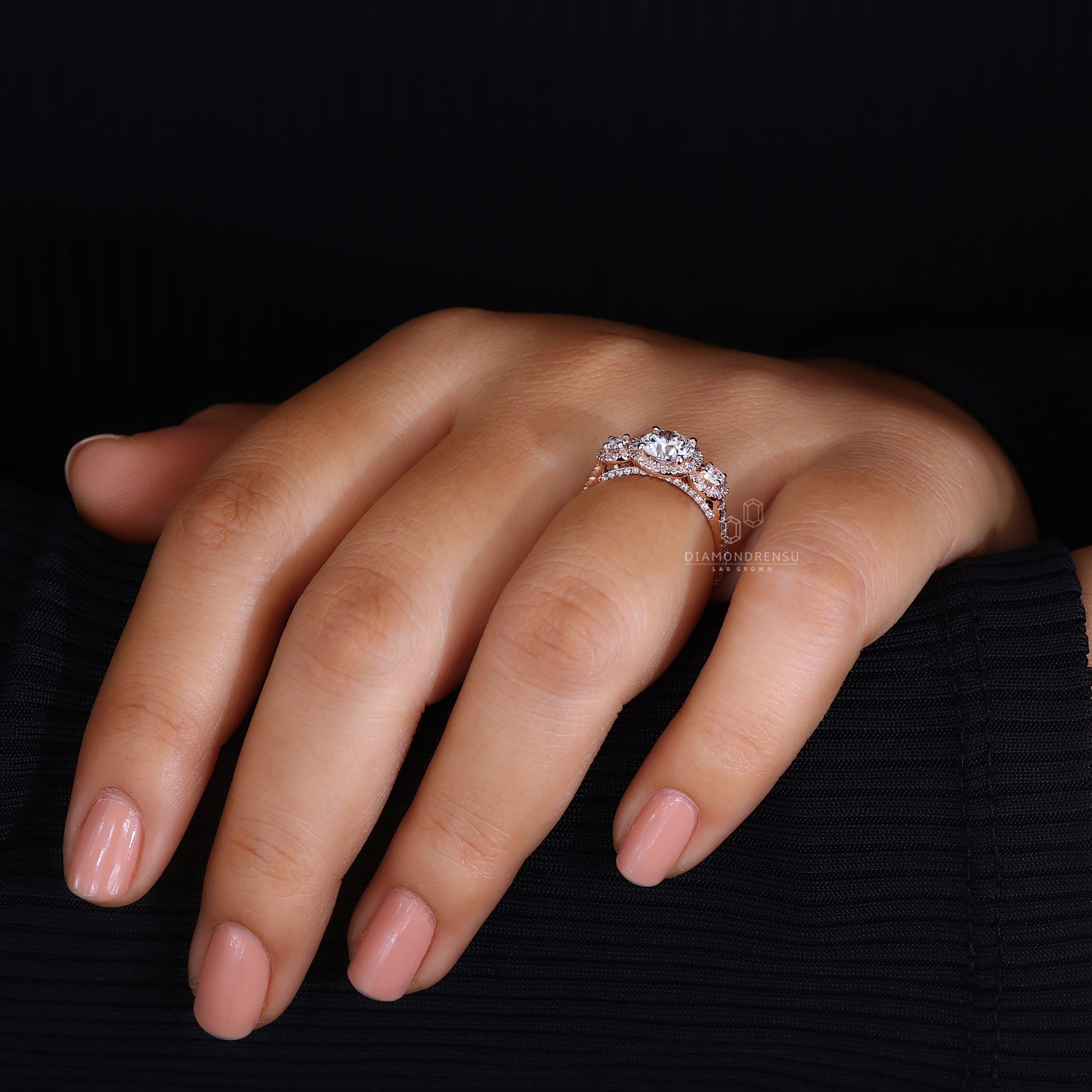 4 round prong setting three stone ring.
