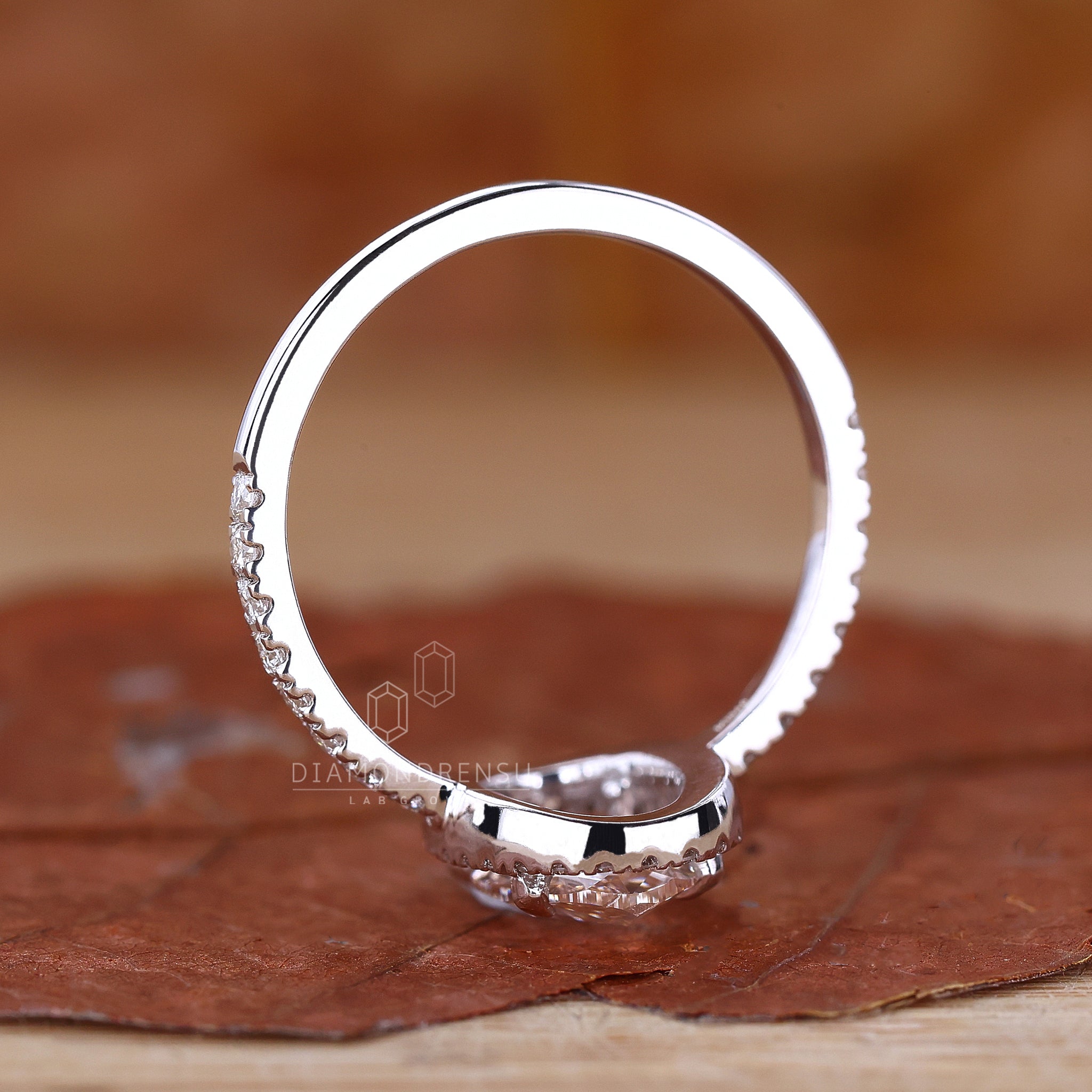 UK engagement ring featuring pave setting.
