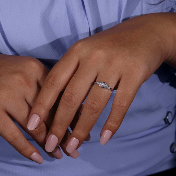 White gold signet ring womens style with delicate detailing.