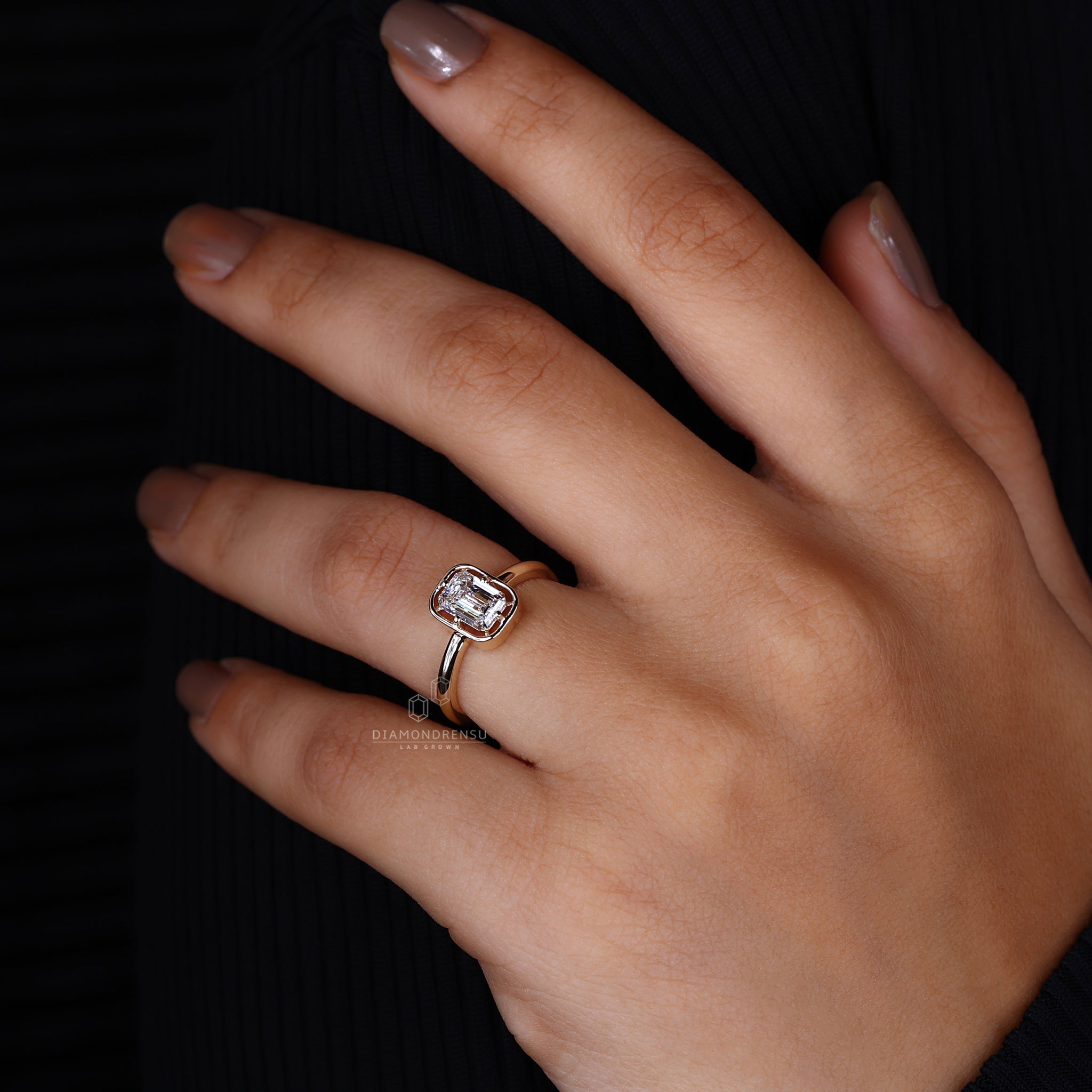 UK engagement ring made using emerald and yellow gold combination.
