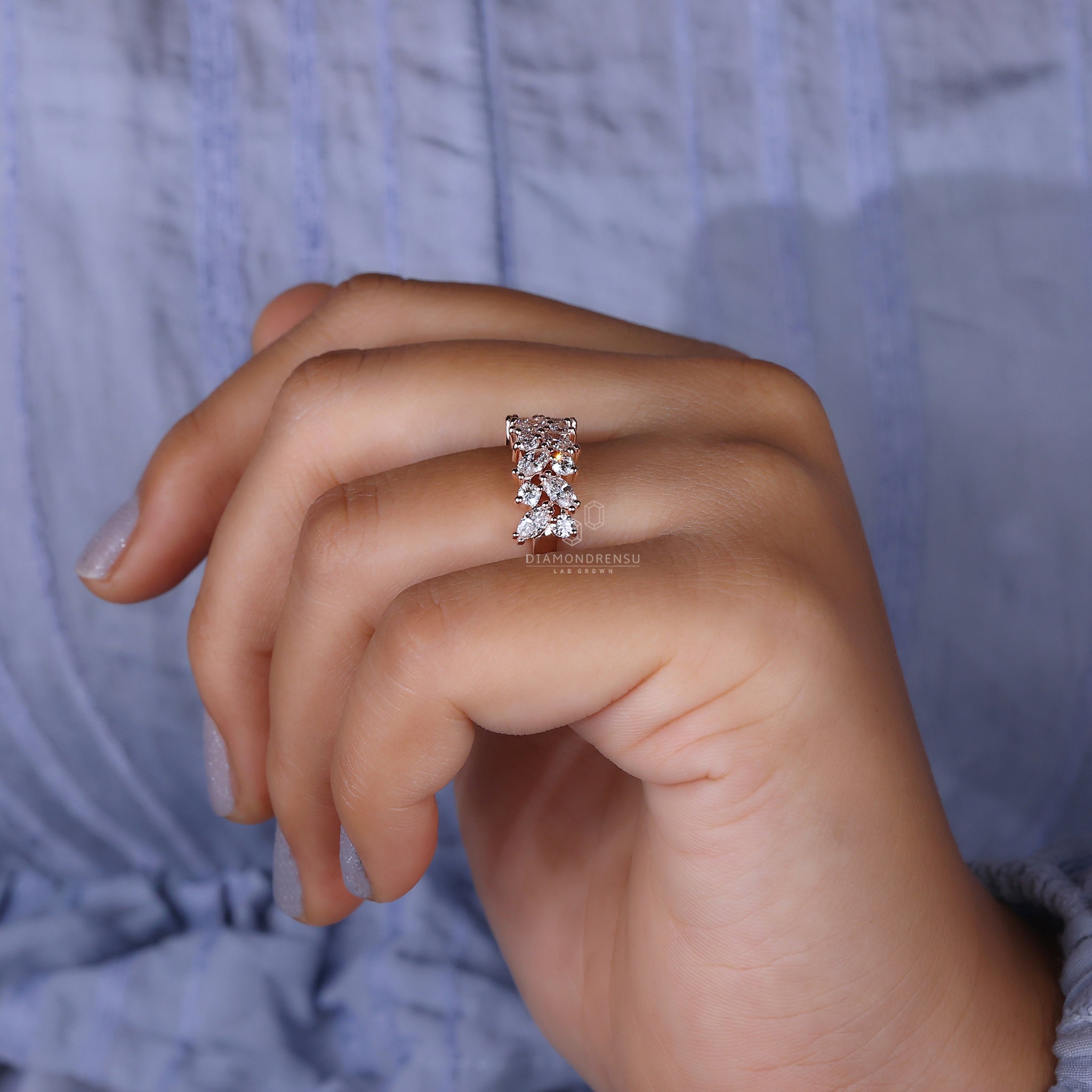 Diamondrensu UK marquise and round diamond wedding band.

