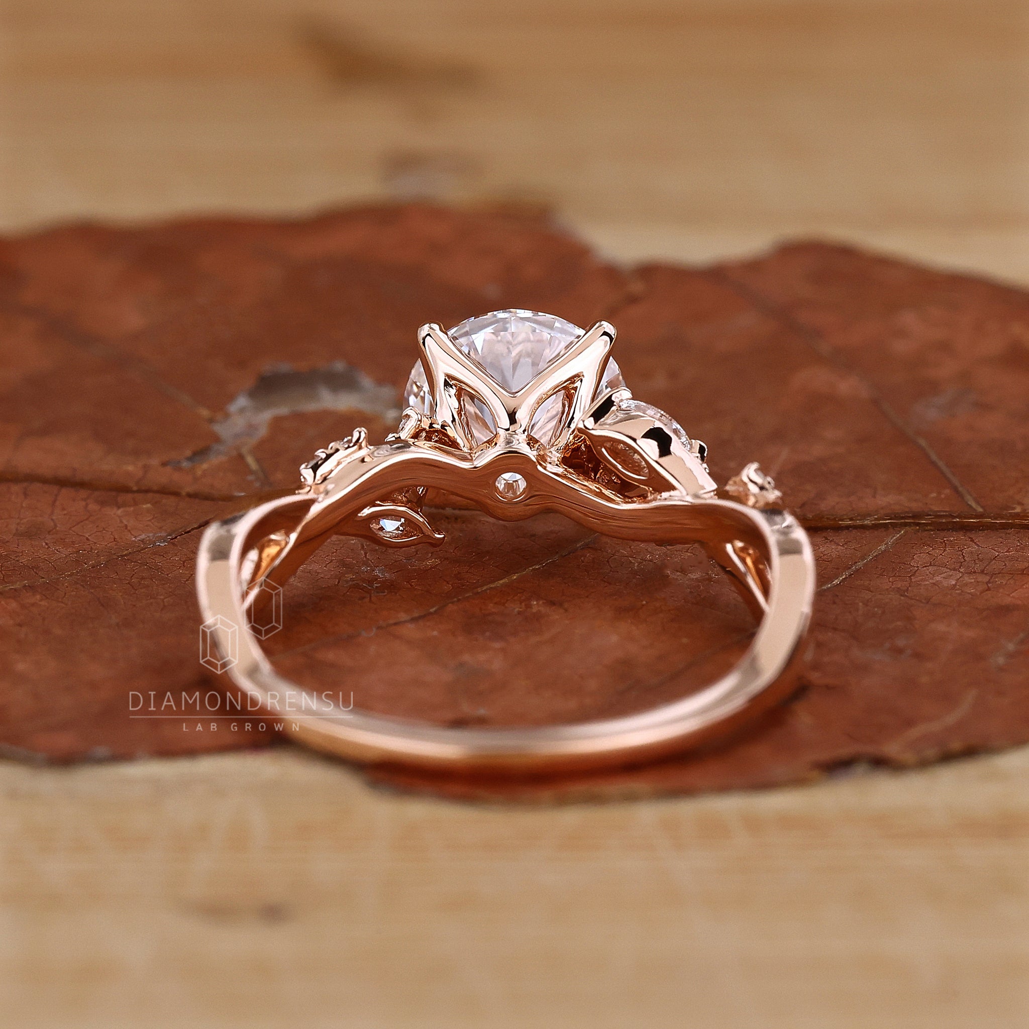 Round diamond engagement ring with a 4 prong claw setting.