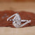 Pear diamond ring with bypass setting engagement ring.
