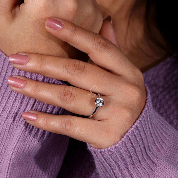 White gold bezel engagement ring with handmade craftsmanship.