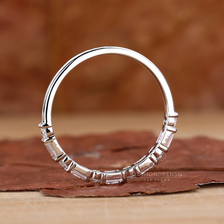 Wedding band UK with emerald cut diamonds.
