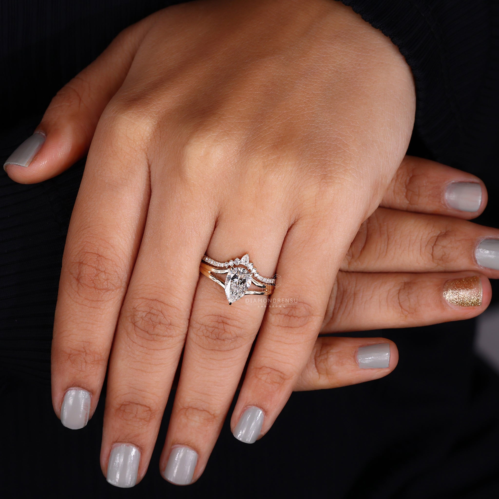 Split shank pear diamond engagement ring.
