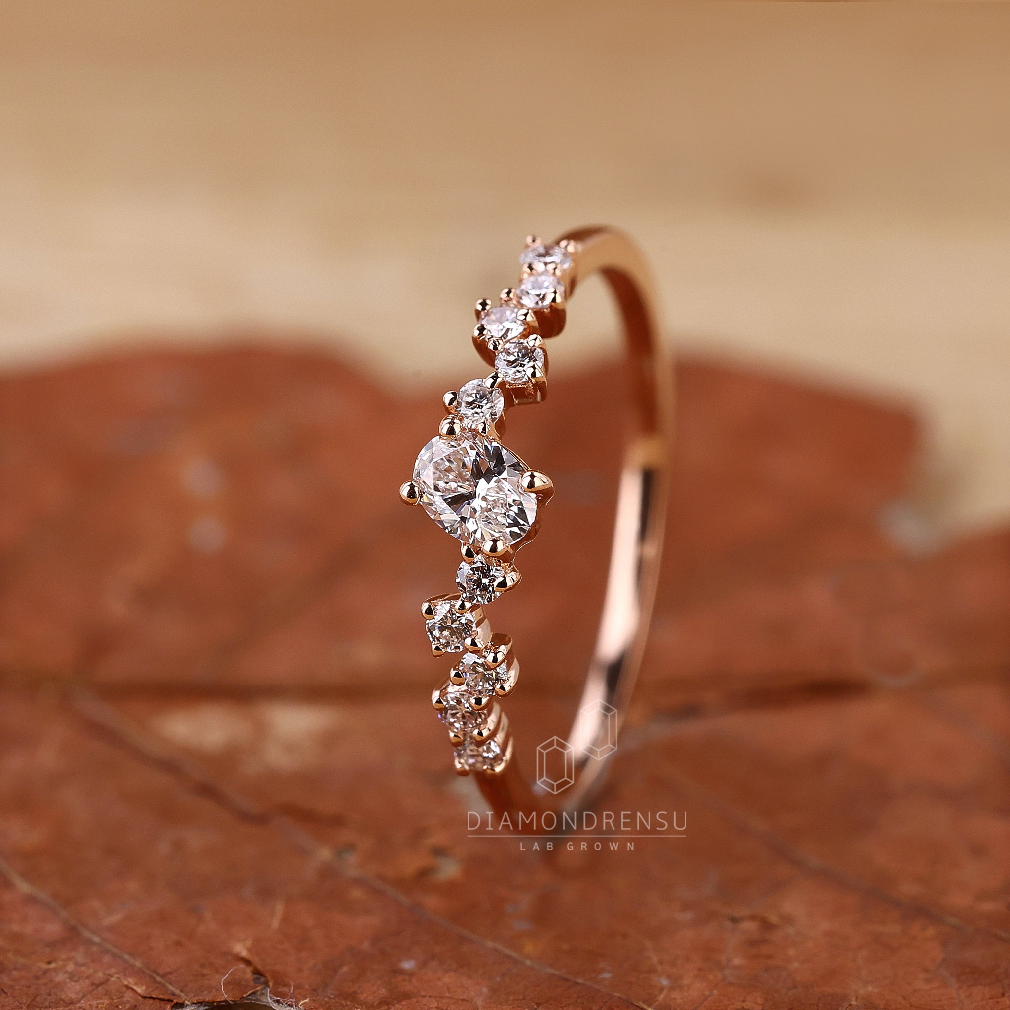 Oval and round diamond rose gold ring.
