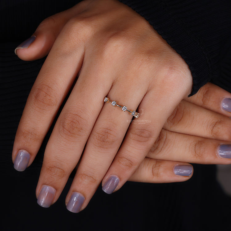 Claw prong set round diamond wedding band in gold
