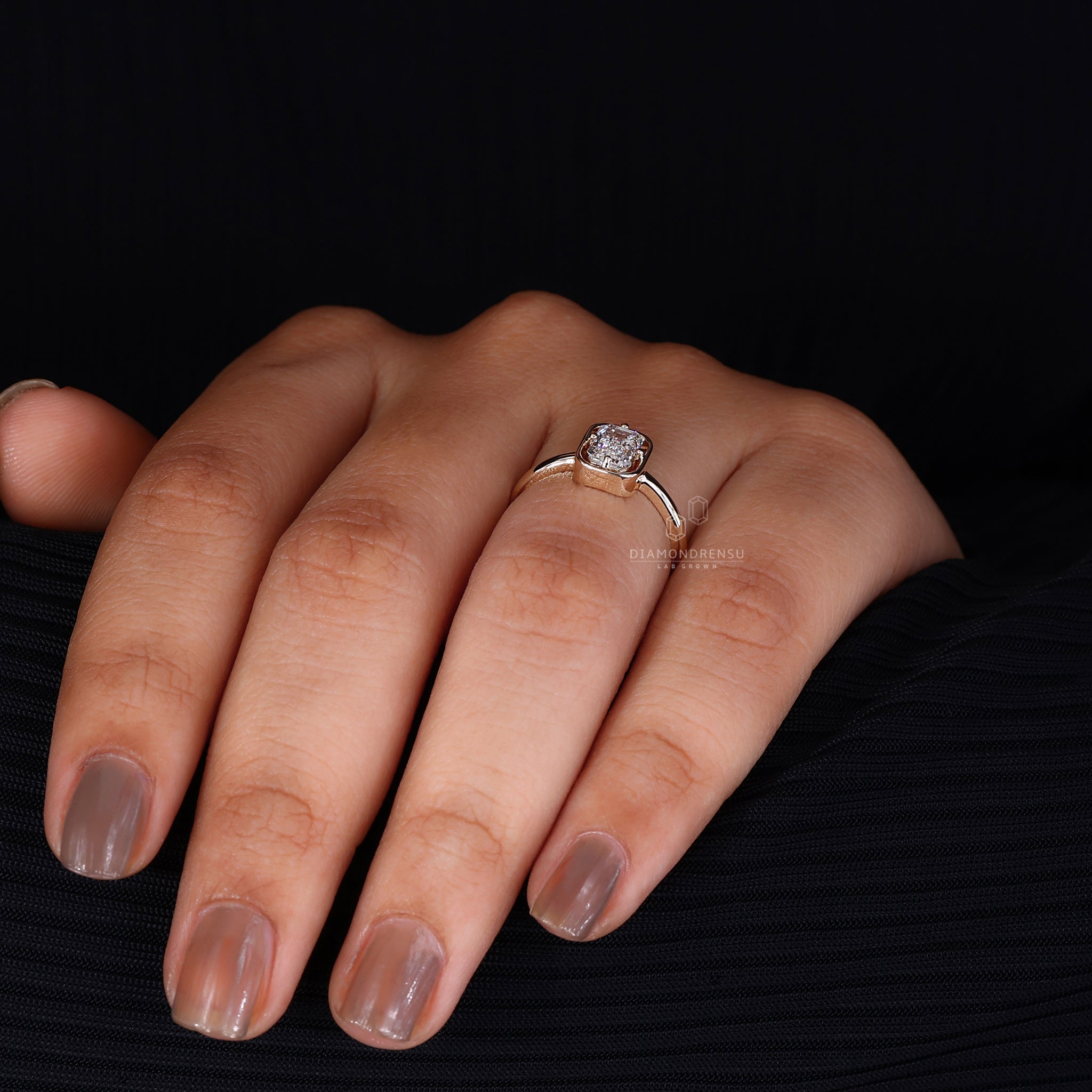 Compass prong ring holds the diamond securely.
