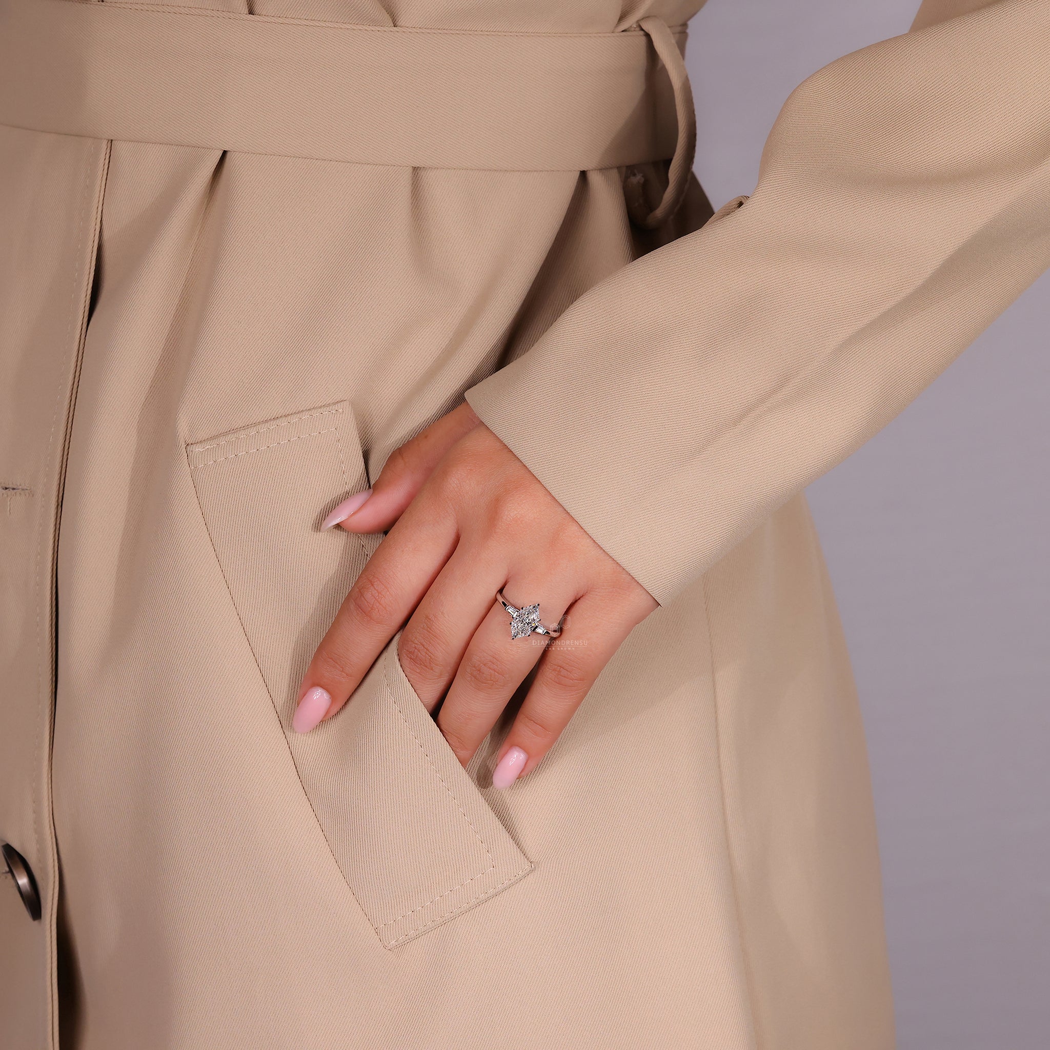 Three stone engagement ring with Dutch Marquise center.
