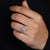 Pear ring with halo engagement style.
