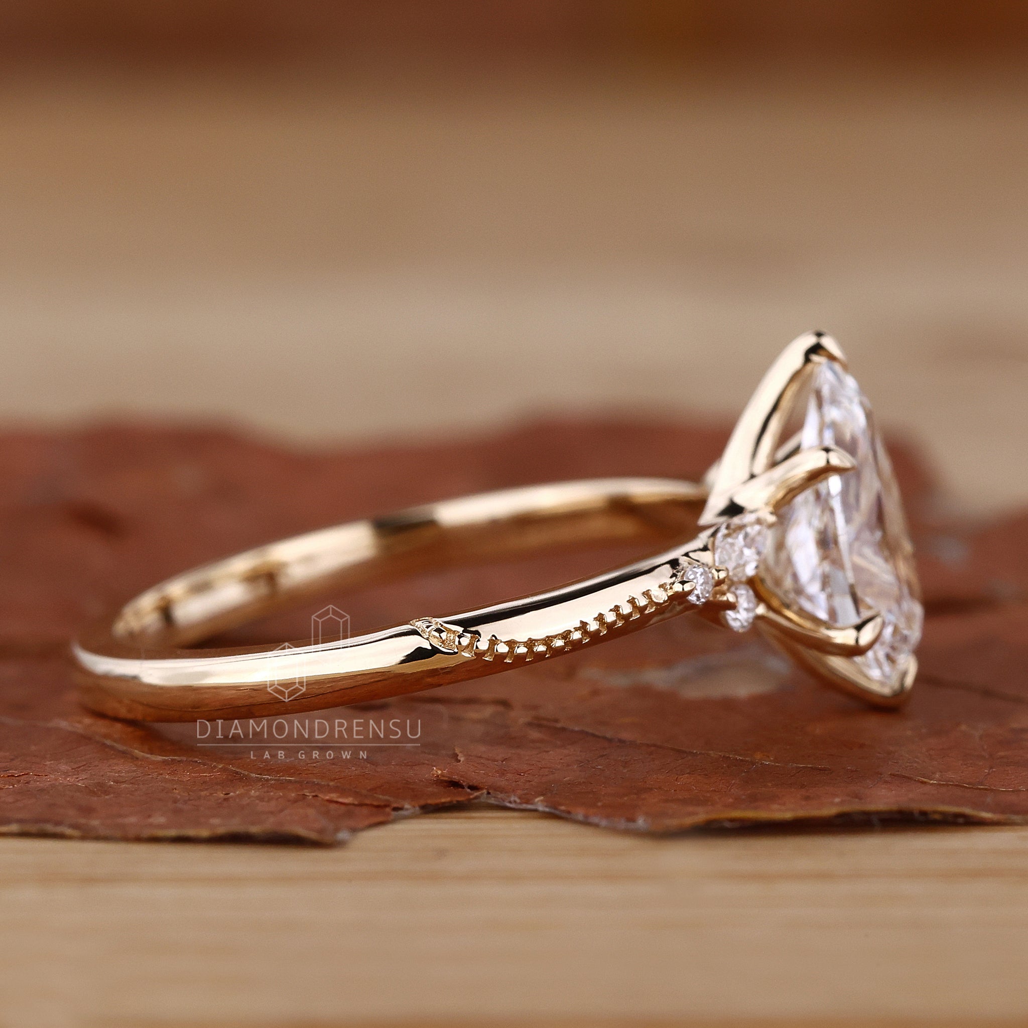 Pear cut engagement ring with a stunning muse setting.