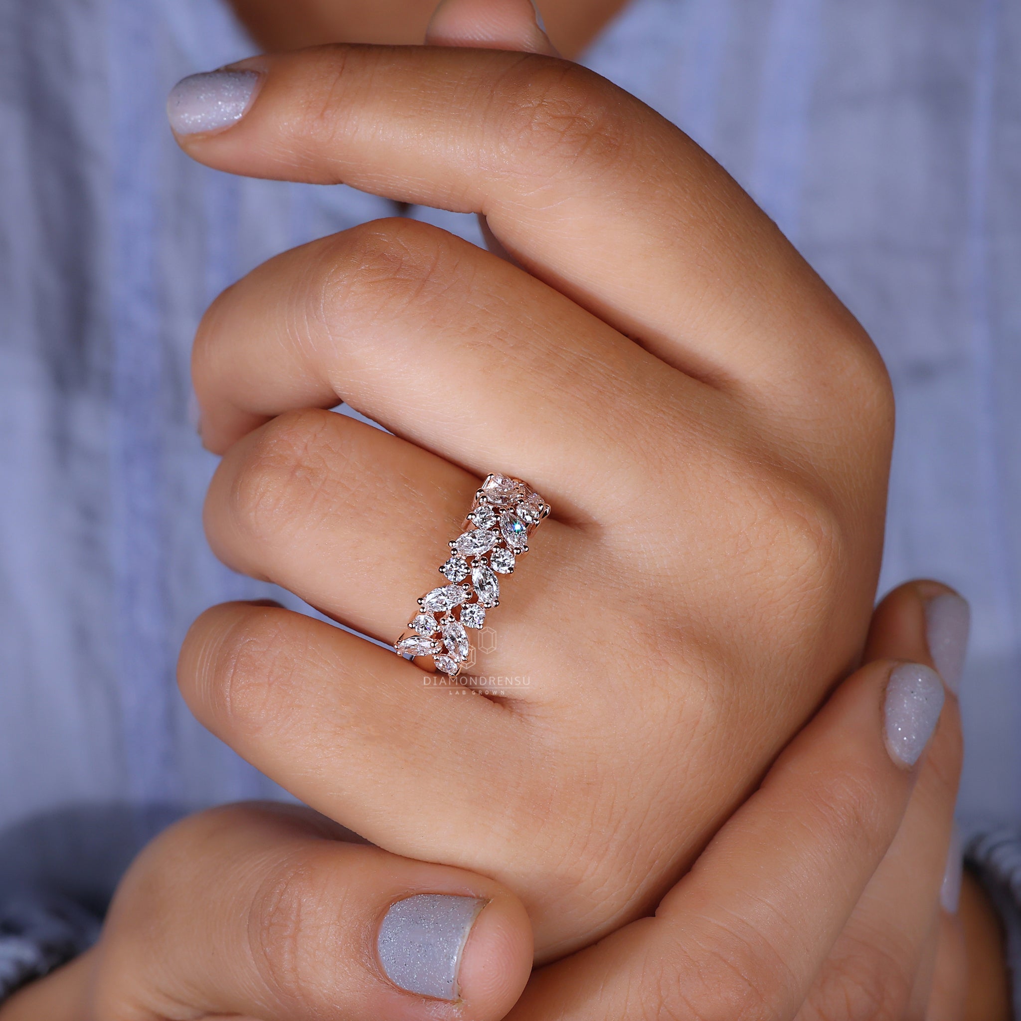 Lab diamond wedding band with round prong setting.
