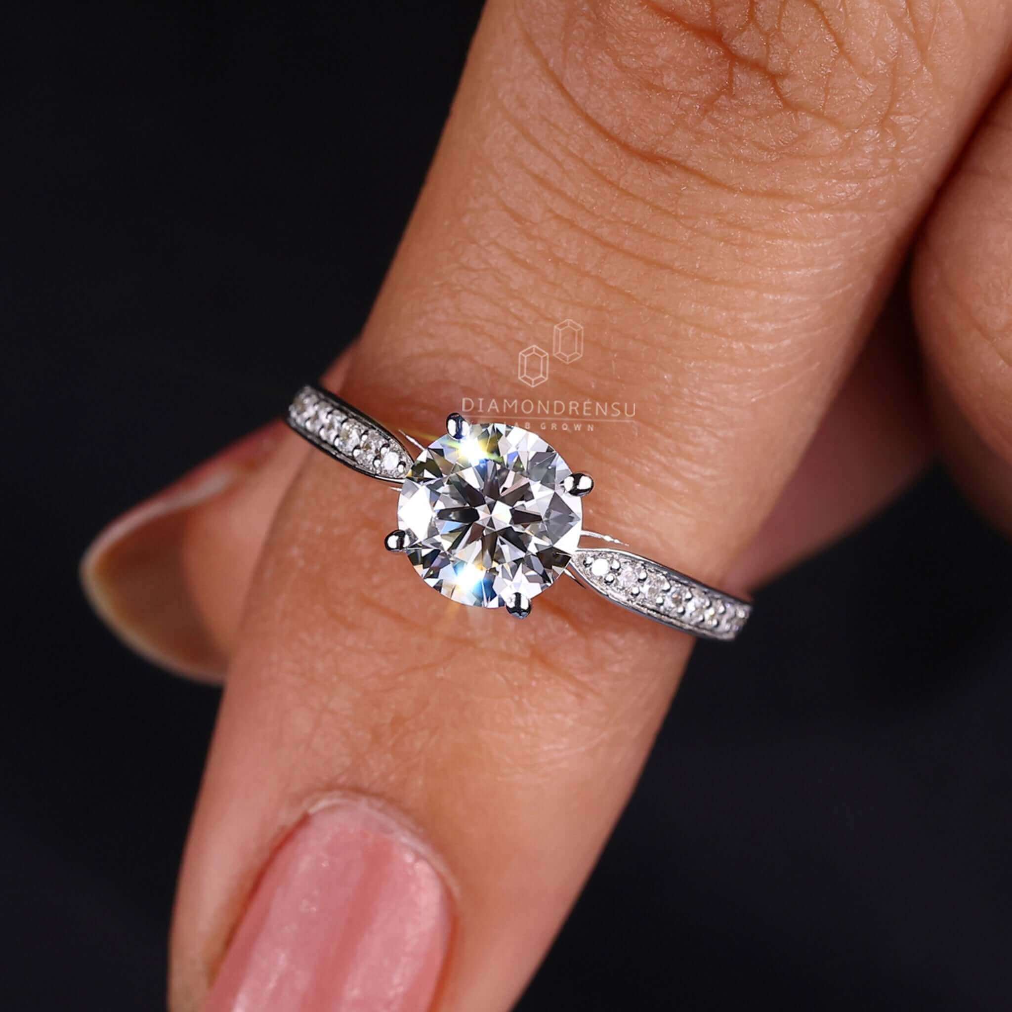 Pave diamond ring with a 2 carat round diamond ring, crafted with a cathedral setting for timeless elegance.