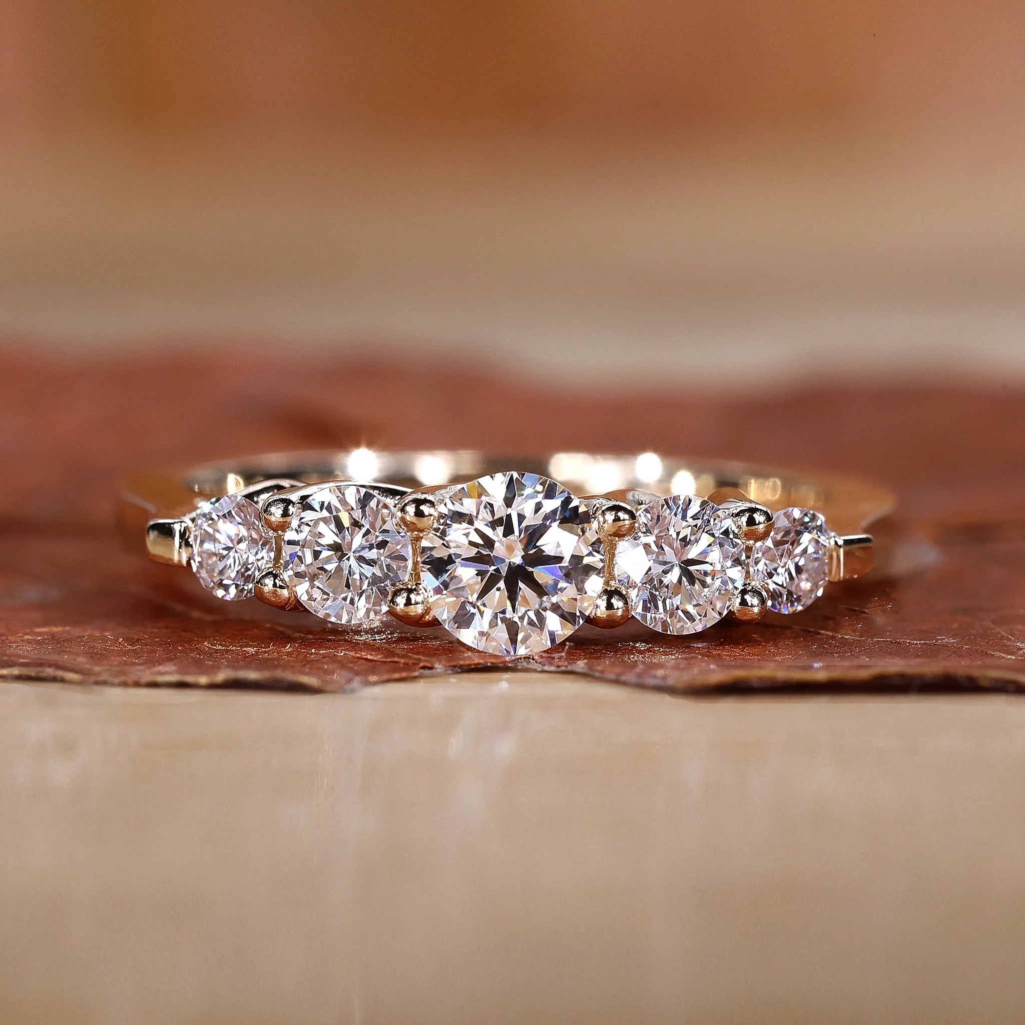 Five stone diamond wedding band in yellow gold
