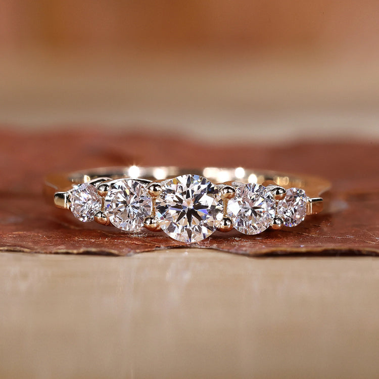 Five stone diamond wedding band in yellow gold