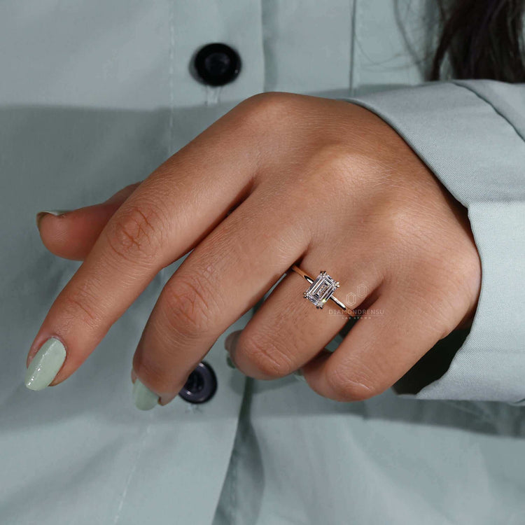 White gold solitaire ring with a minimalist claw prong setting.