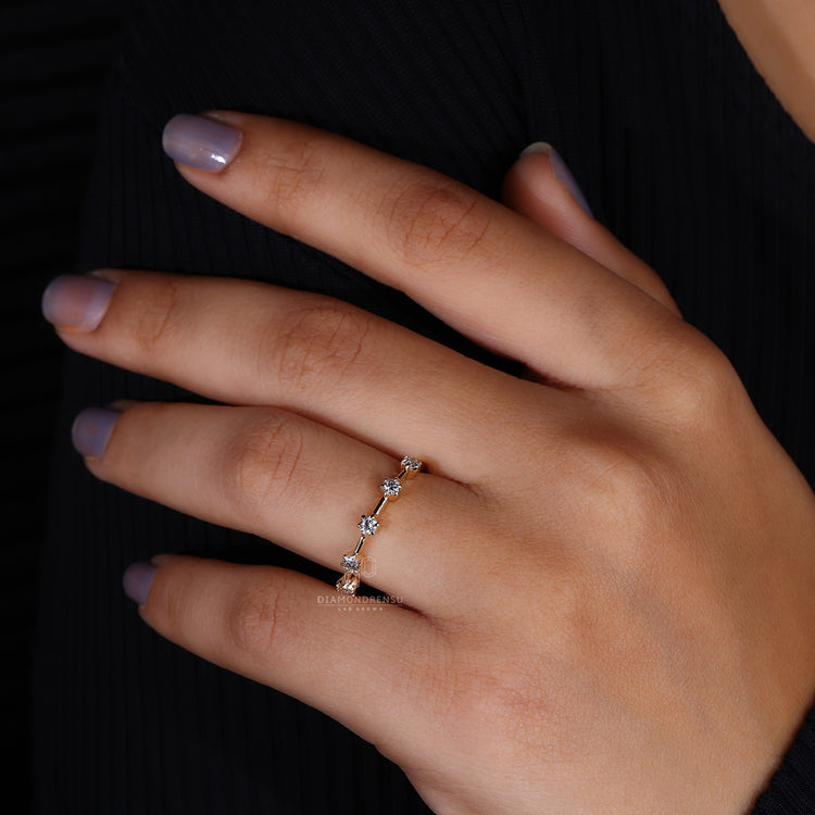 Minimalist yellow gold diamond band with pave setting
