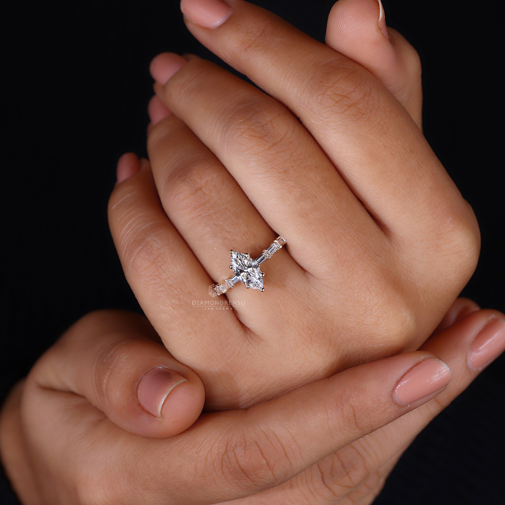 UK engagement ring in marquise baguette style.
