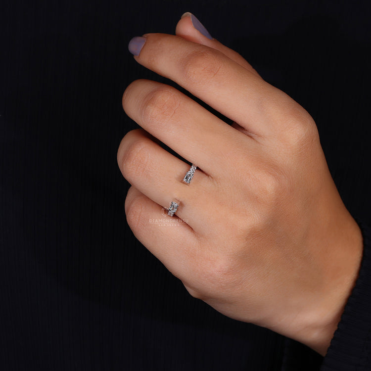 Prong set open band with lab grown emerald and round diamonds
