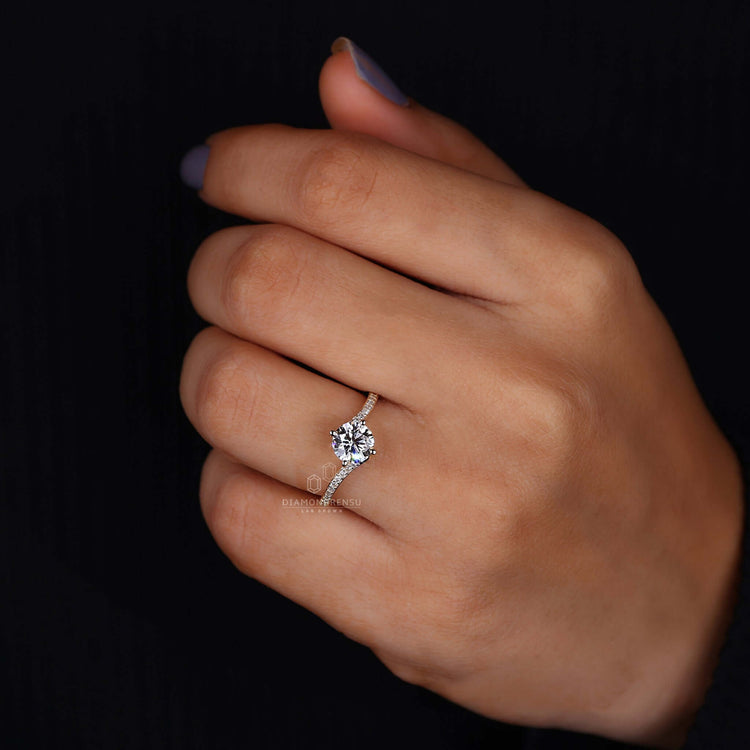 A round-cut diamond ring in a bypass design, offering a unique and sophisticated style.