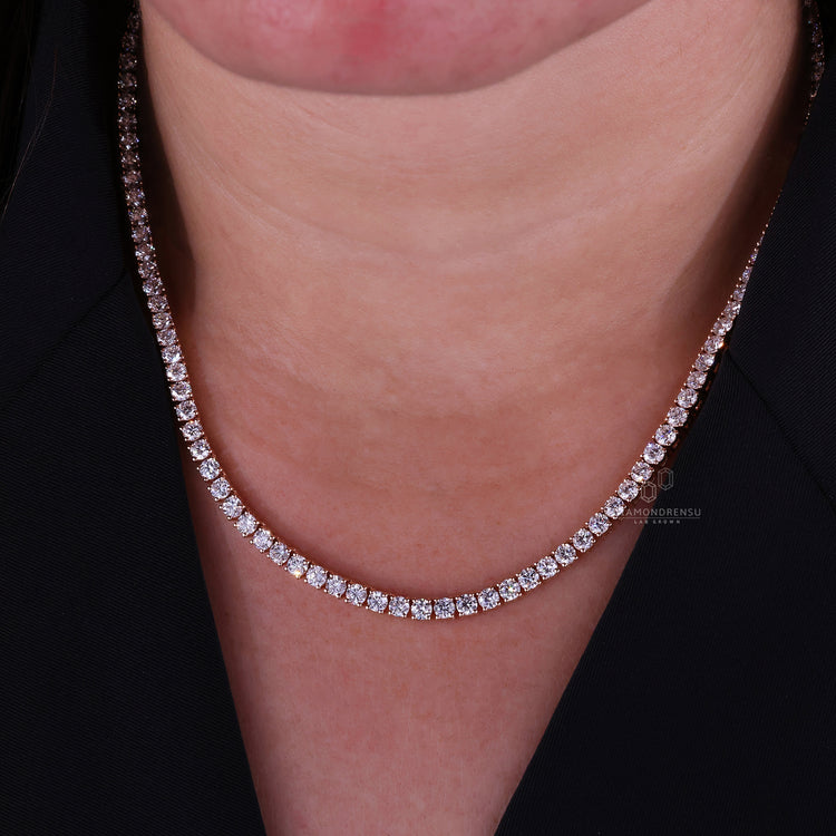 Custom necklace crafted in rose gold with brilliant round cut diamonds.
