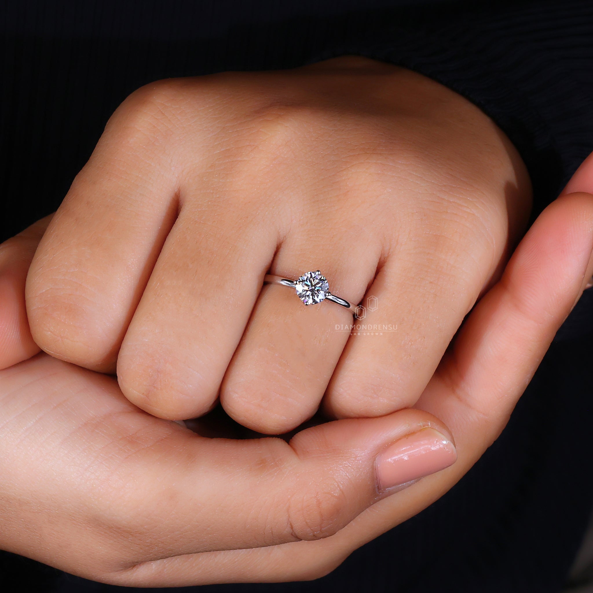 Round compass prong setting engagement ring.
